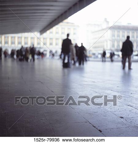 Stock Photograph - Large group of people walking on the road. Fotosearch