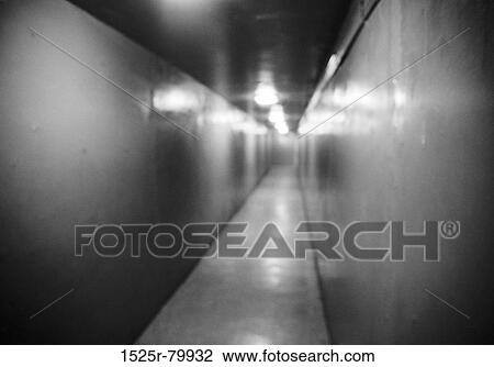 Lights shining in an empty corridor View Large Photo Image Stock Image - Lights shining in an empty corridor. Fotosearch