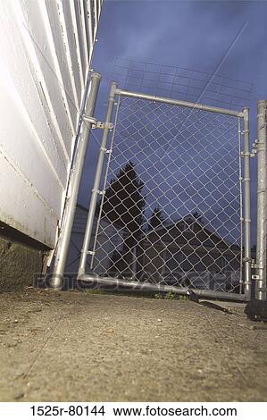Low angle view of a metal gate View Large Photo Image Picture - Low angle view of a metal gate. Fotosearch