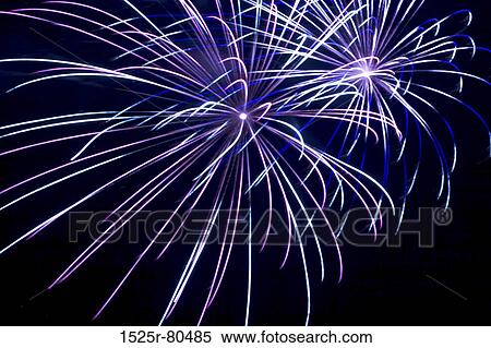 Low angle view of fireworks at night View Large Photo Image Stock Photography - Low angle view of fireworks at night. Fotosearch