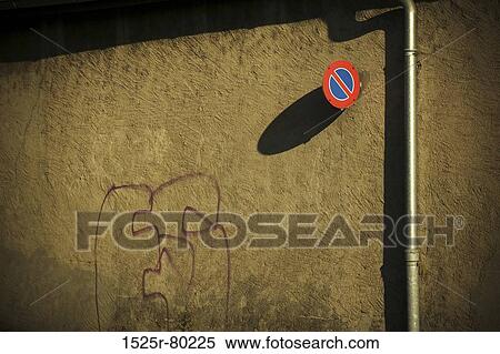 Low angle view of No Stopping sign on a wall View Large Photo Image Stock Photography - Low angle view of No Stopping sign on a wall. Fotosearch