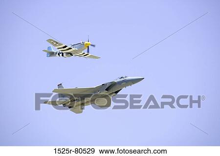 Low angle view of two airplanes flying in the sky View Large Photo Image Stock Photo - Low angle view of two airplanes flying in the sky. Fotosearch