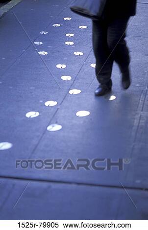 Low section view of a man walking on the road View Large Photo Image Stock Photography - Low section view of a man walking on the road. Fotosearch