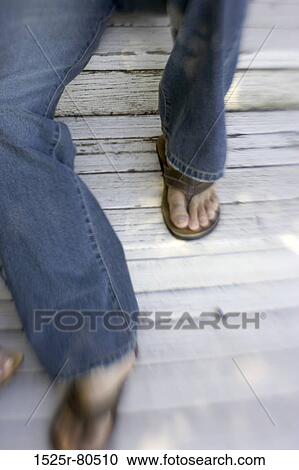 Low section view of a person View Large Photo Image Stock Image - Low section view of a person. Fotosearch