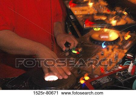 Stock Image - Mid section view of a disc jockey. Fotosearch