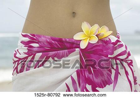 Mid section view of a woman wearing a sarong View Large Photo Image Stock Image - Mid section view of a woman wearing a sarong. Fotosearch