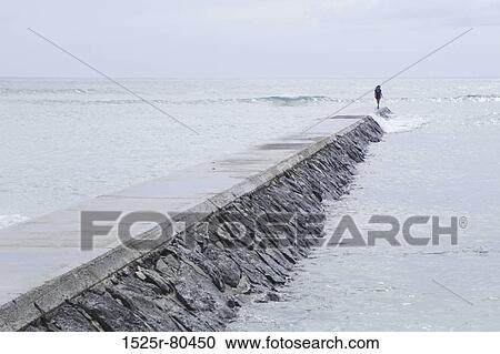 Person standing on a jetty View Large Photo Image Stock Image - Person standing on a jetty. Fotosearch