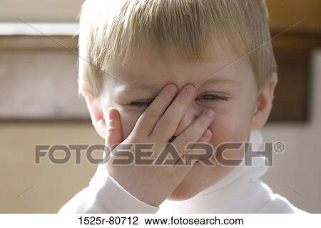 Portrait of a boy covering his mouth with his hand View Large Photo Image Stock Image - Portrait of a boy covering his mouth with his hand. Fotosearch