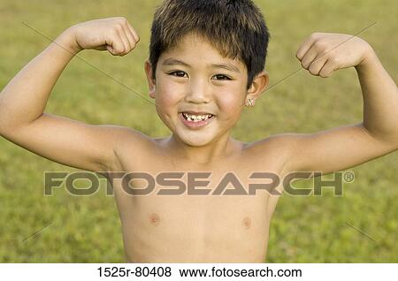 Portrait of a boy flexing his muscles View Large Photo Image Stock Photo - Portrait of a boy flexing his muscles. Fotosearch