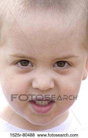 Stock Photo - Portrait of a boy staring. Fotosearch
