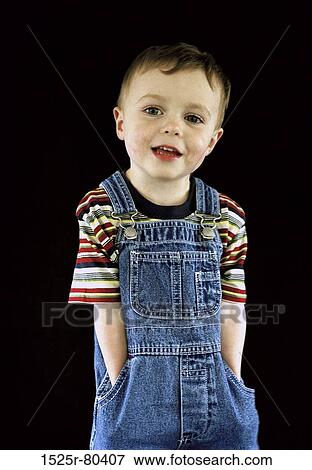Portrait of a boy with his hands in his pockets View Large Photo Image Stock Photo - Portrait of a boy with his hands in his pockets. Fotosearch