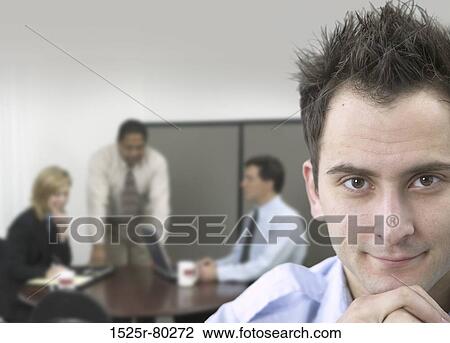 Portrait of a businessman smiling with his hand on his chin View Large Photo Image Stock Image - Portrait of a businessman smiling with his hand on his chin. Fotosearch