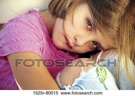 Portrait of a girl hugging her knees View Large Photo Image Stock Photography - Portrait of a girl hugging her knees. Fotosearch