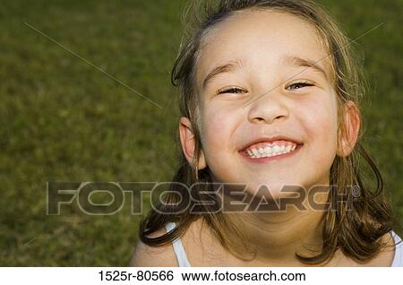 Portrait of a girl smiling View Large Photo Image Stock Photograph - Portrait of a girl smiling. Fotosearch