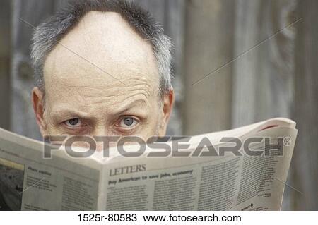 Portrait of a mature man reading a newspaper View Large Photo Image Stock Image - Portrait of a mature man reading a newspaper. Fotosearch