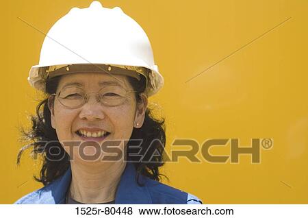Portrait of a mature woman smiling View Large Photo Image Stock Photo - Portrait of a mature woman smiling. Fotosearch