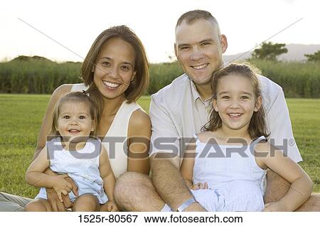 Portrait of a mid adult couple with their two children View Large Photo Image Stock Photo - Portrait of a mid adult couple with their two children. Fotosearch