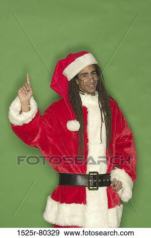 Portrait of a Santa Claus pointing upward View Large Photo Image Stock Photo - Portrait of a Santa Claus pointing upward. Fotosearch