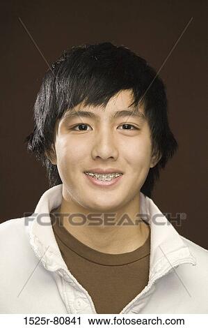 Stock Image - Portrait of a young man smiling. Fotosearch