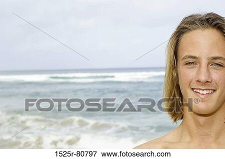 Portrait of a young man smiling View Large Photo Image Stock Photo - Portrait of a young man smiling. Fotosearch