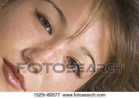 Portrait of a young woman looking serious View Large Photo Image Stock Photo - Portrait of a young woman looking serious. Fotosearch