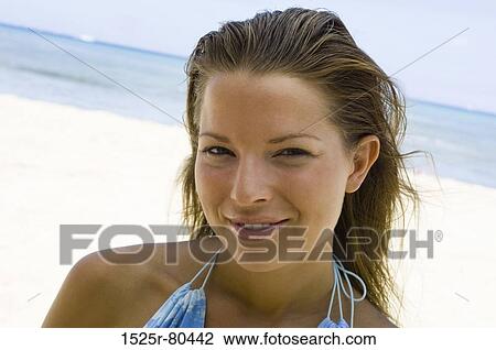 Portrait of a young woman smiling View Large Photo Image Stock Image - Portrait of a young woman smiling. Fotosearch