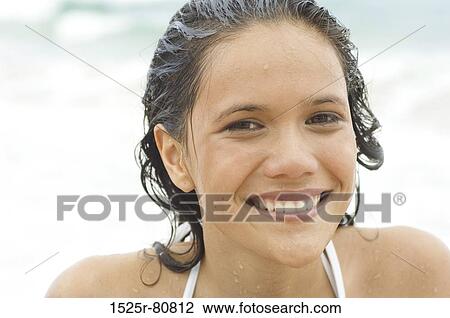 Portrait of a young woman smiling View Large Photo Image Stock Image - Portrait of a young woman smiling. Fotosearch