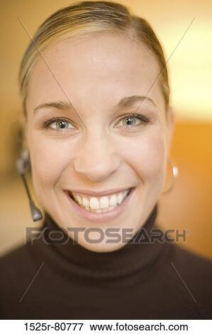 Portrait of a young woman smiling View Large Photo Image Stock Photo - Portrait of a young woman smiling. Fotosearch
