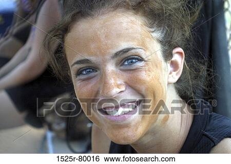Stock Photograph - Portrait of a young woman smiling. Fotosearch