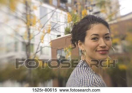 Stock Photography - Portrait of a young woman smiling. Fotosearch