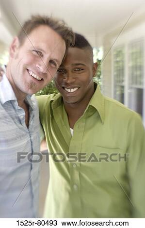 Portrait of two young men smiling View Large Photo Image Stock Image - Portrait of two young men smiling. Fotosearch