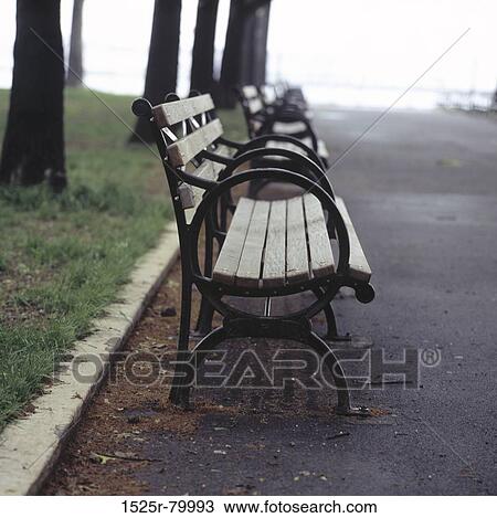 Row of benches on a roadside View Large Photo Image Stock Image - Row of benches on a roadside. Fotosearch