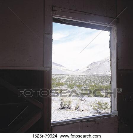 Shrubs and mountains seen through an window View Large Photo Image Picture - Shrubs and mountains seen through an window. Fotosearch