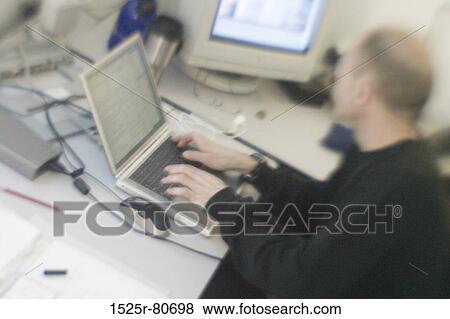 Side profile of an architect using a laptop View Large Photo Image Stock Photo - Side profile of an architect using a laptop. Fotosearch