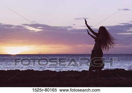 Silhouette of a woman standing on the beach View Large Photo Image Stock Photography - Silhouette of a woman standing on the beach. Fotosearch