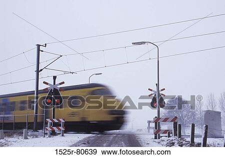 Train moving on a railroad track View Large Photo Image Stock Photo - Train moving on a railroad track. Fotosearch