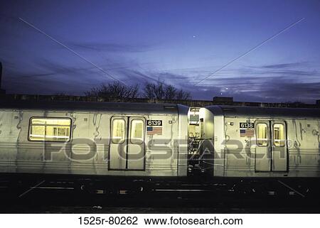 Train on a railroad track at night View Large Photo Image Stock Image - Train on a railroad track at night. Fotosearch