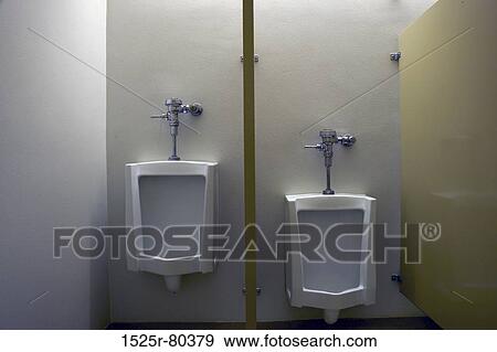 Two urinals in a restroom View Large Photo Image Stock Photo - Two urinals in a restroom. Fotosearch