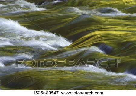 Stock Photo - Water flowing over rocks. Fotosearch