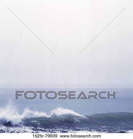 Waves breaking on rocks View Large Photo Image Stock Photo - Waves breaking on rocks. Fotosearch