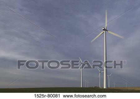Wind turbines on a field View Large Photo Image Stock Image - Wind turbines on a field. Fotosearch