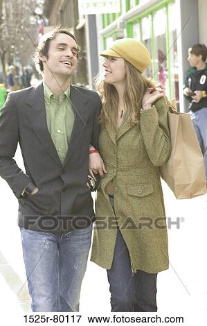 Young couple walking on the road and smiling View Large Photo Image Stock Photo - Young couple walking on the road and smiling. Fotosearch