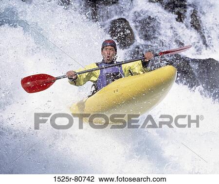 Young man kayaking View Large Photo Image Stock Image - Young man kayaking. Fotosearch