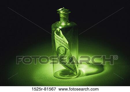 American dollar bill in a bottle View Large Photo Image Stock Photo - American dollar bill in a bottle. Fotosearch