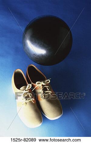 Bowling shoes with a bowling ball View Large Photo Image Stock Photo - Bowling shoes with a bowling ball. Fotosearch