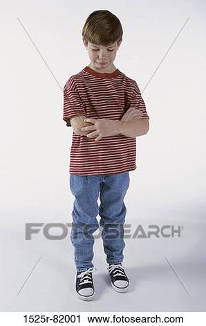 Boy making a sad face looking down View Large Photo Image Stock Image - Boy making a sad face looking down. Fotosearch