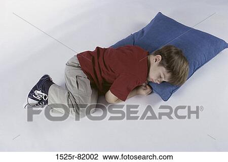 Boy sleeping on a pillow View Large Photo Image Stock Image - Boy sleeping on a pillow. Fotosearch