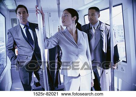 Business executives in a subway train View Large Photo Image Stock Image - Business executives in a subway train. Fotosearch