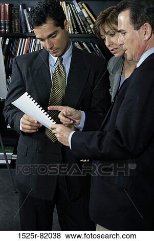 Stock Photo - Business executives talking. Fotosearch