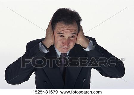 Businessman covering his ears with his hands View Large Photo Image Stock Photo - Businessman covering his ears with his hands. Fotosearch